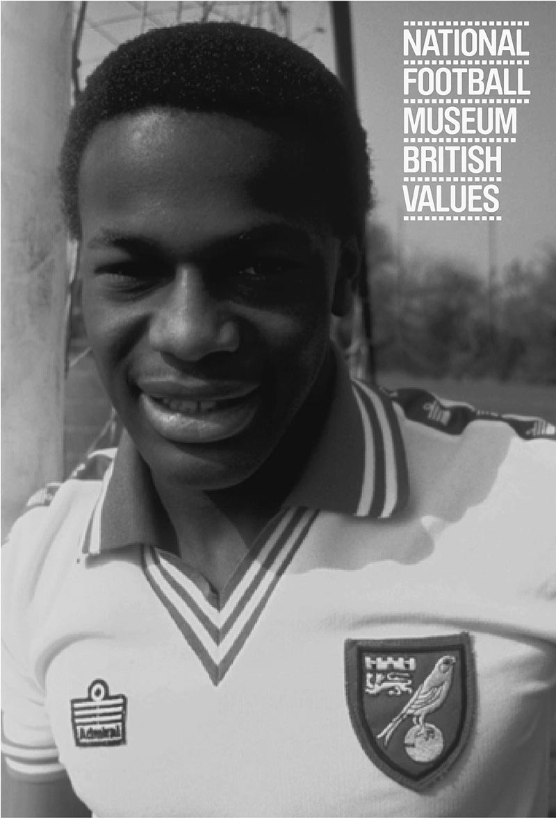 Wearing Norwich City shirt