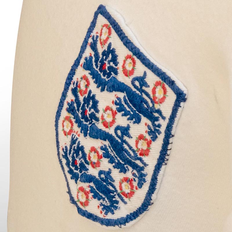 Embroidered blue and red England badge with three lions